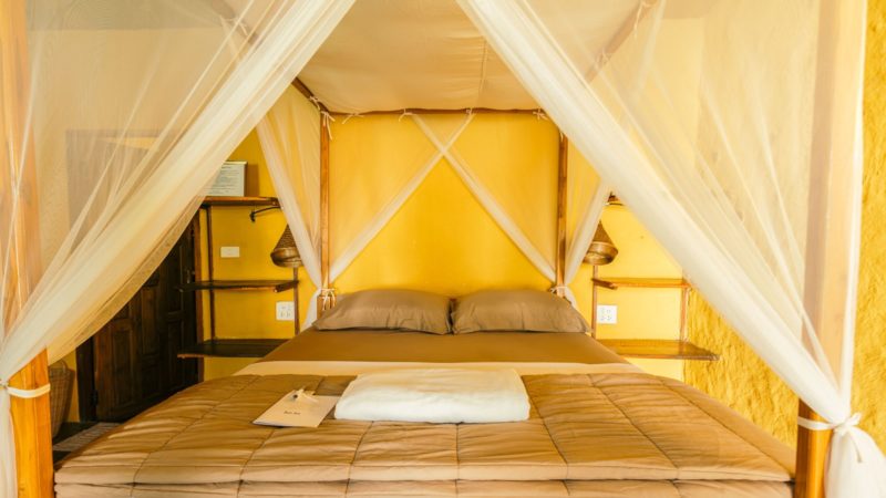 Inside View of Queen Room Blankets and Pillows