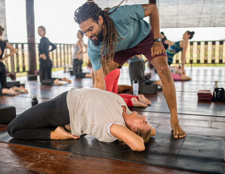 Backbend with Instructor Support at Summer Yoga Meditation Retreat in Chiang Mai