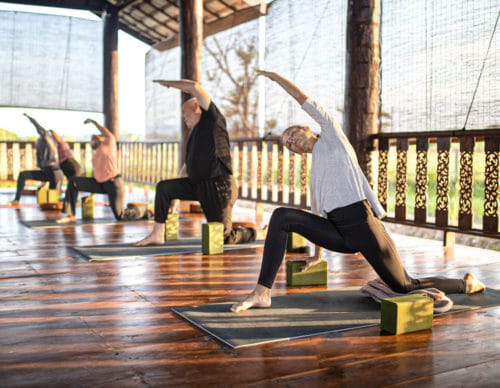 Students in Lunge at Winter Yoga and Meditation Retreat in Chiang Mai