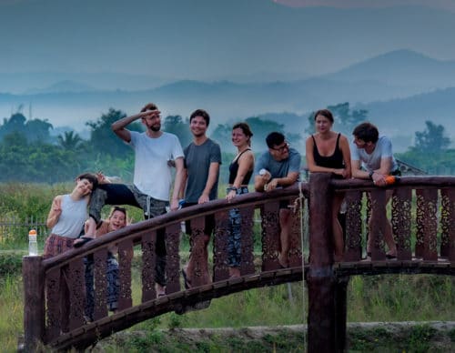 Community Enjoying Sunset at a Yoga Retreat in Thailand